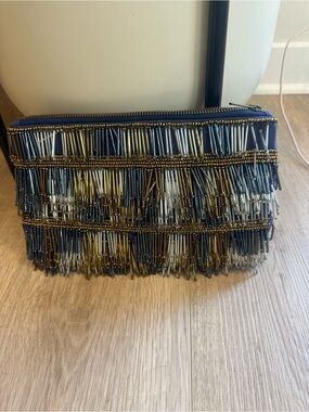 Anthropologie fringed fanfare metallic  clutch